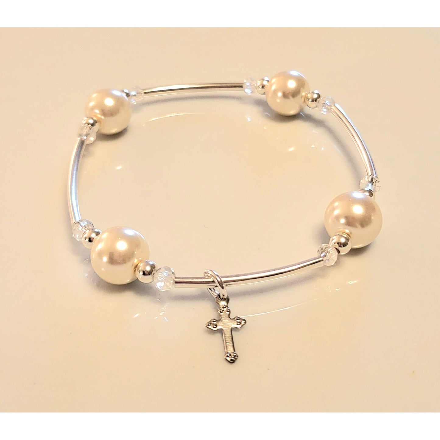 “Sterling silver cross charm detail on the Joyful Blessings Bracelet – unique design by At Your Witts End”