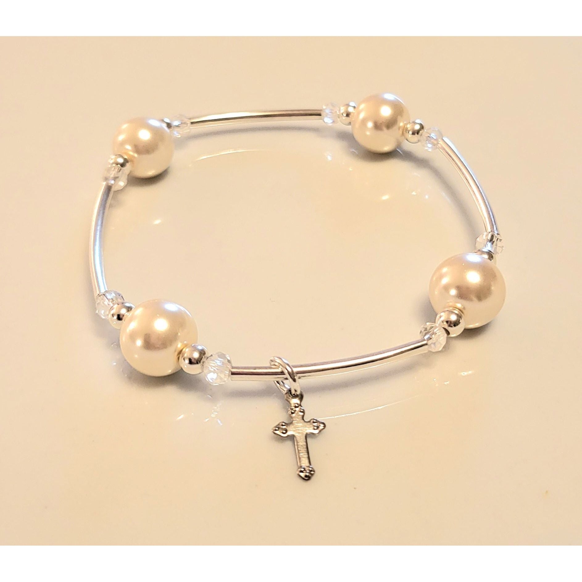 “Sterling silver cross charm detail on the Joyful Blessings Bracelet – unique design by At Your Witts End”