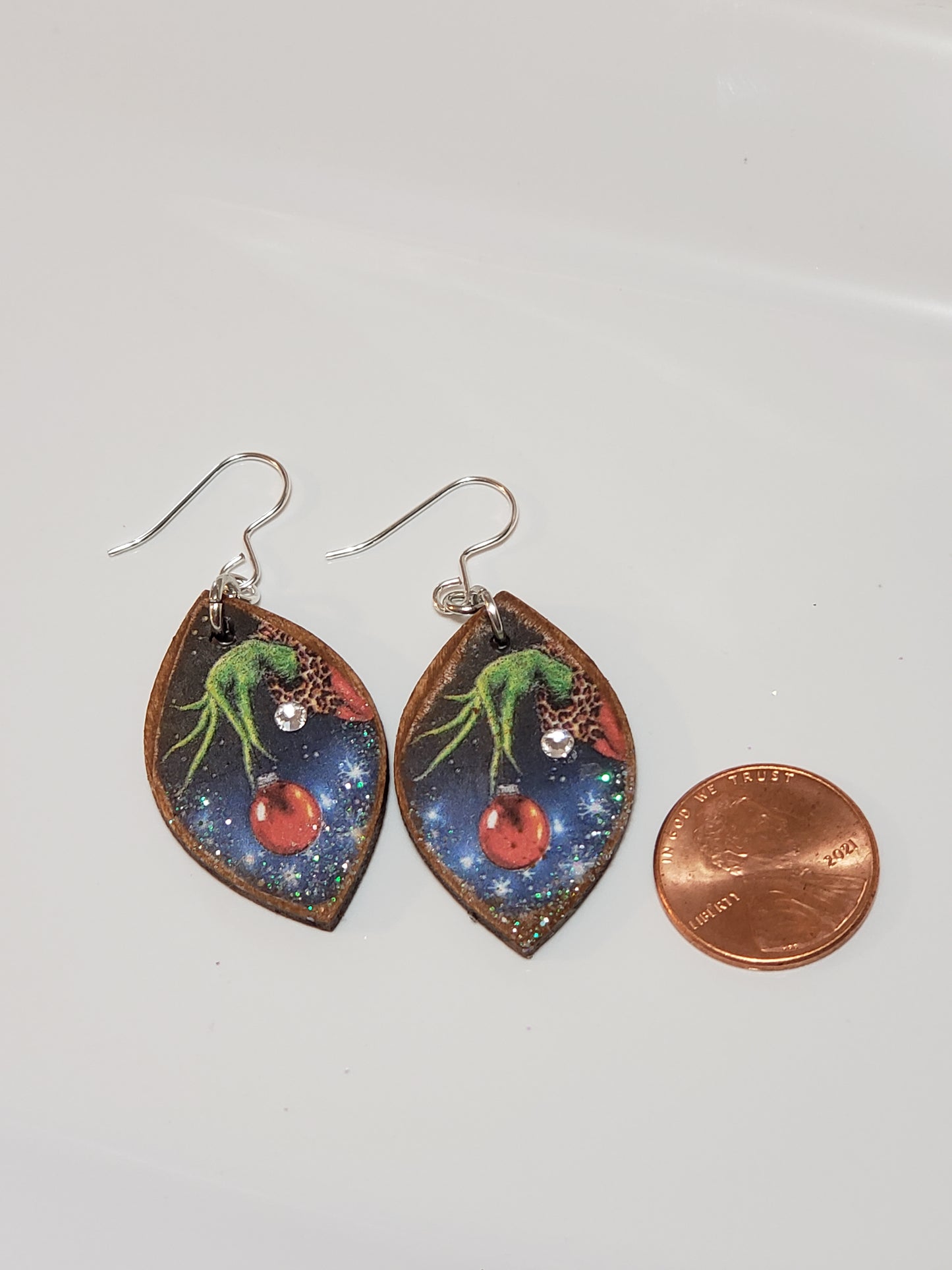 Wooded Decoupage Earrings (Grinch hand with ball)