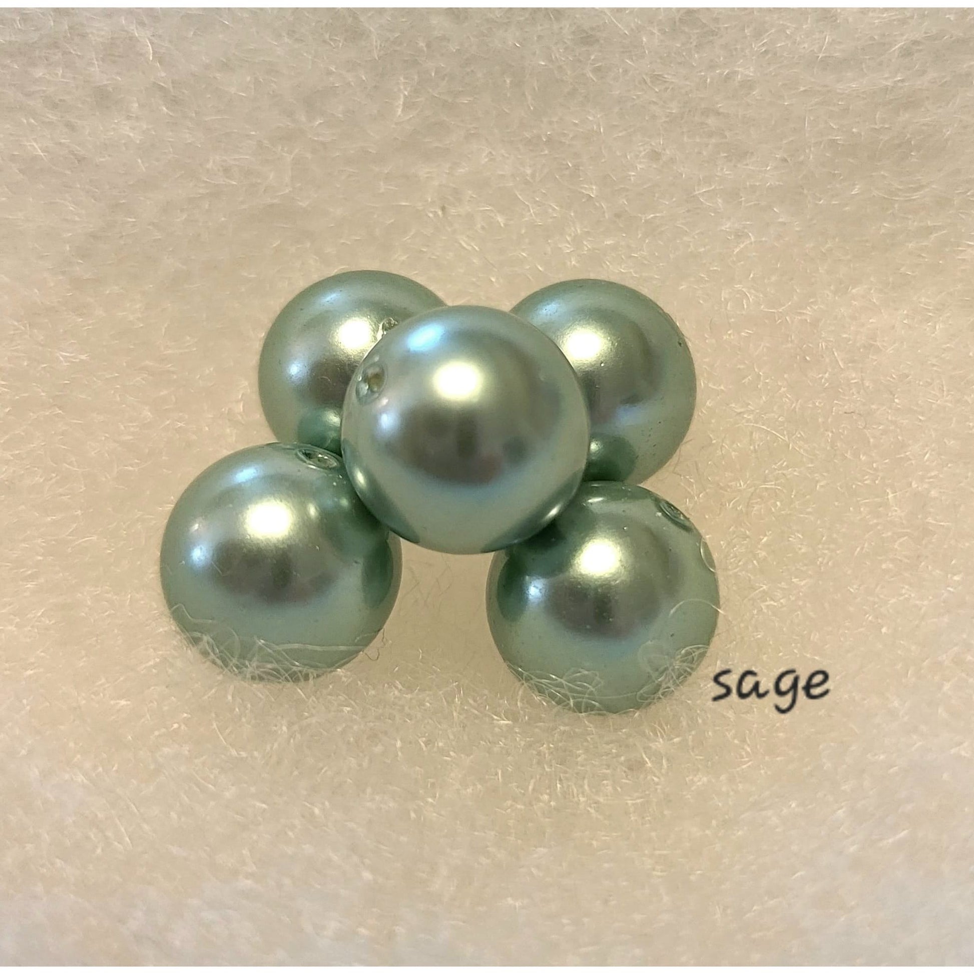 These sage green pearls give a soft look.