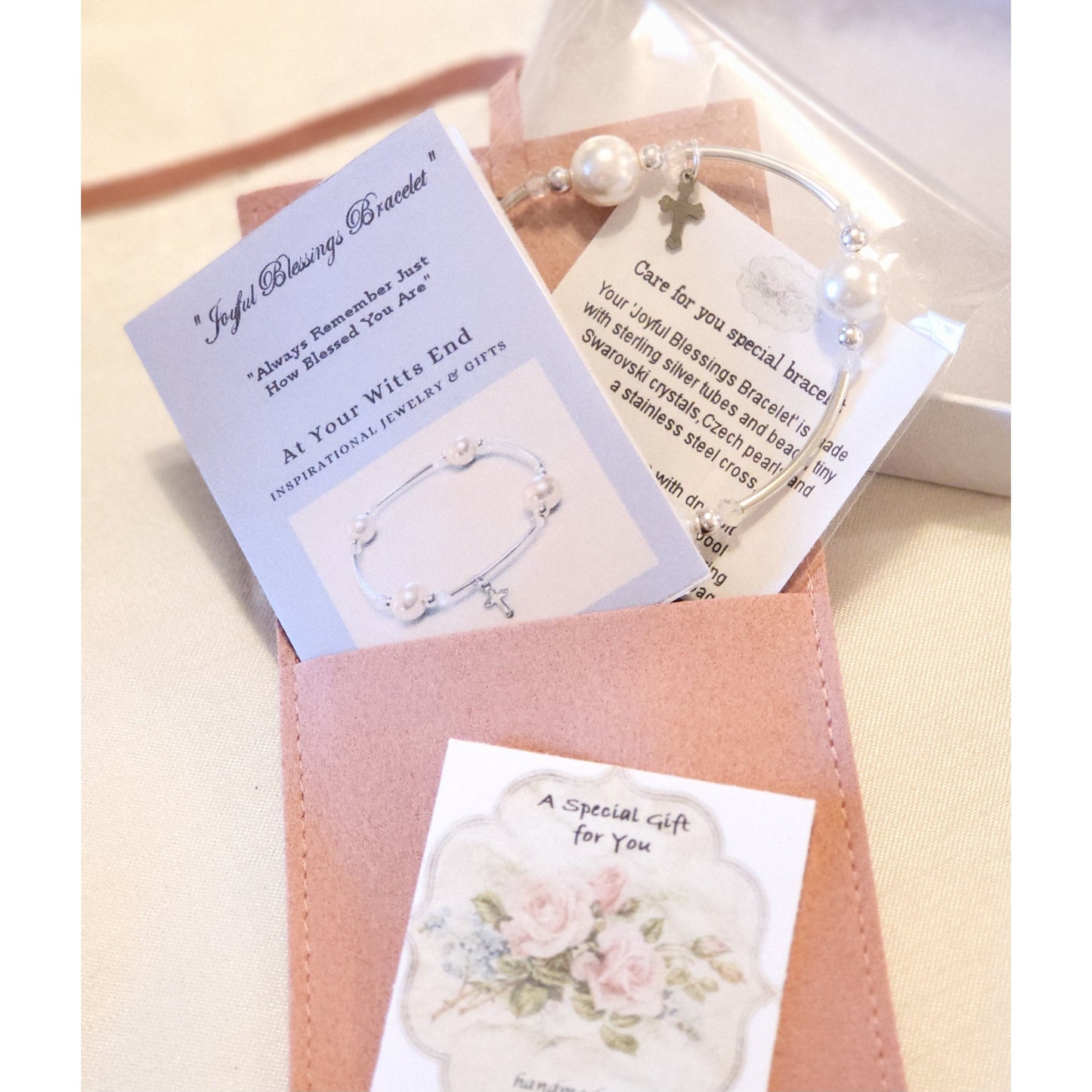 “Faith bracelet packaged in pink suede pouch with gift booklet – ready to give as a meaningful gift”