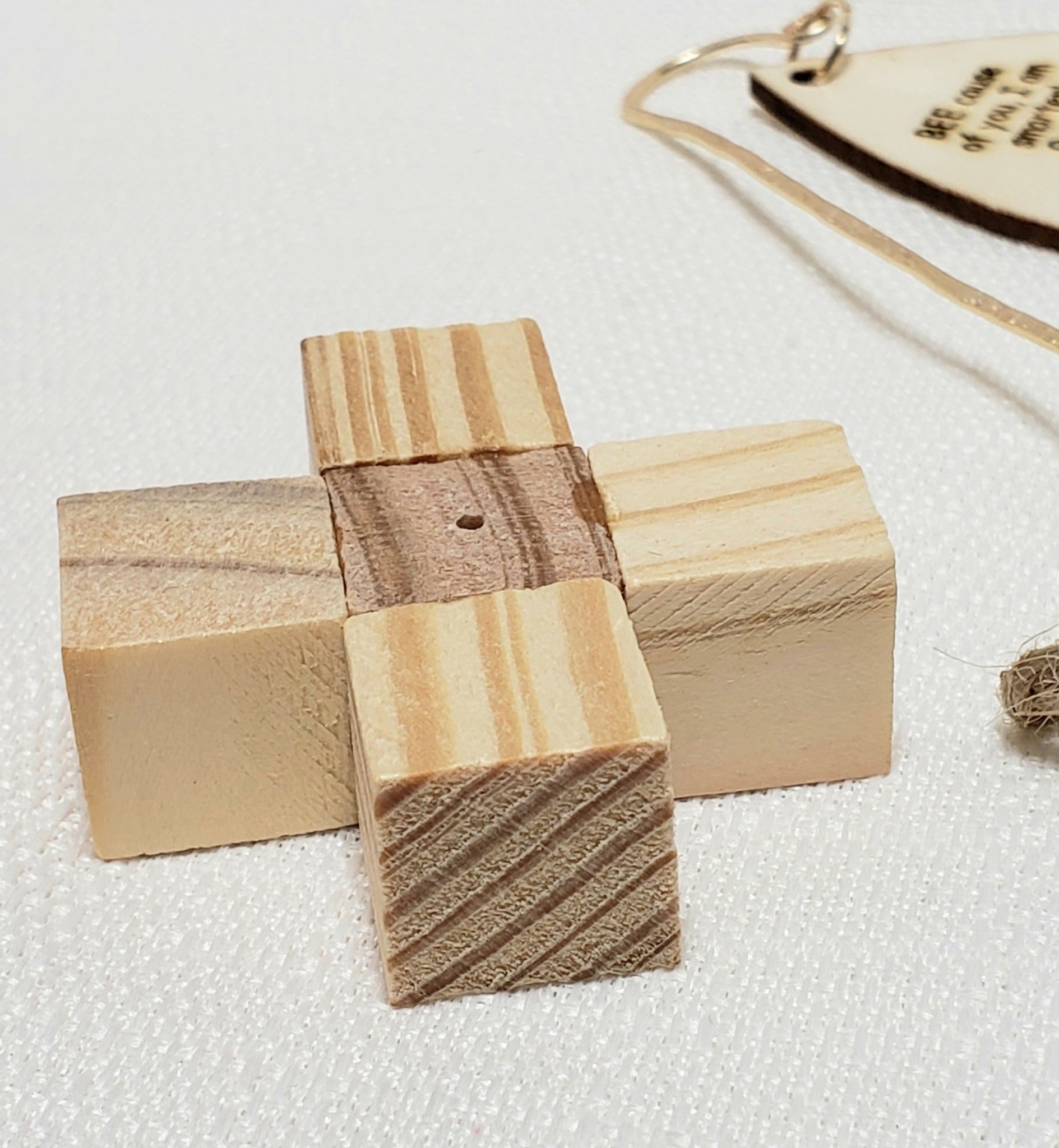 A handmade wood block to keep stake in when not in use in garden or plant.