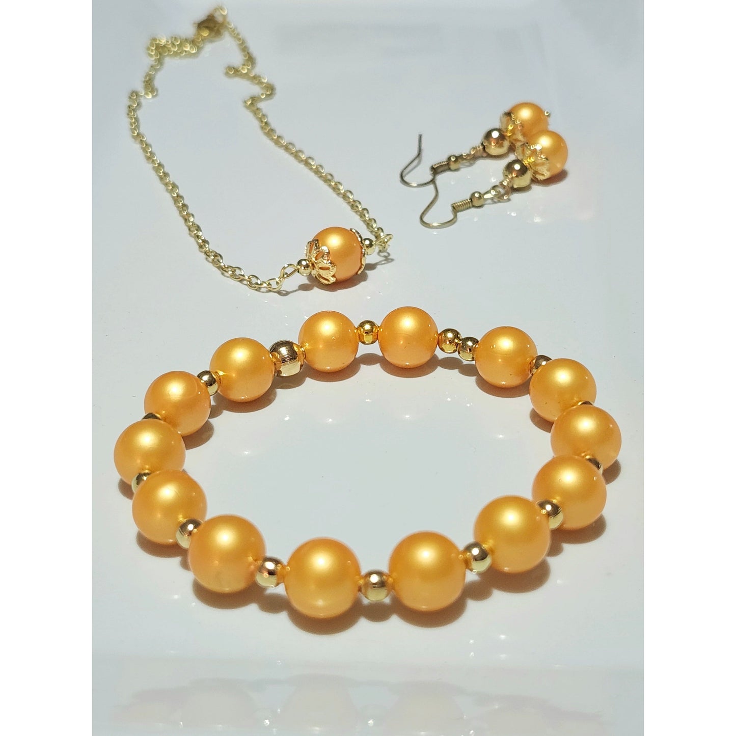 Beautiful Orange Solo Bead on Gold Chain