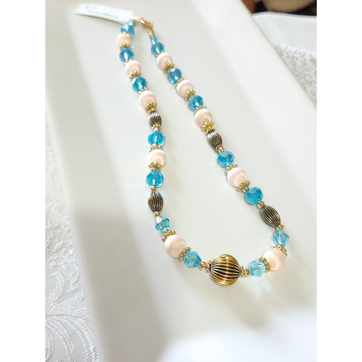 Pale peach thread beads & ice blue crystal necklace