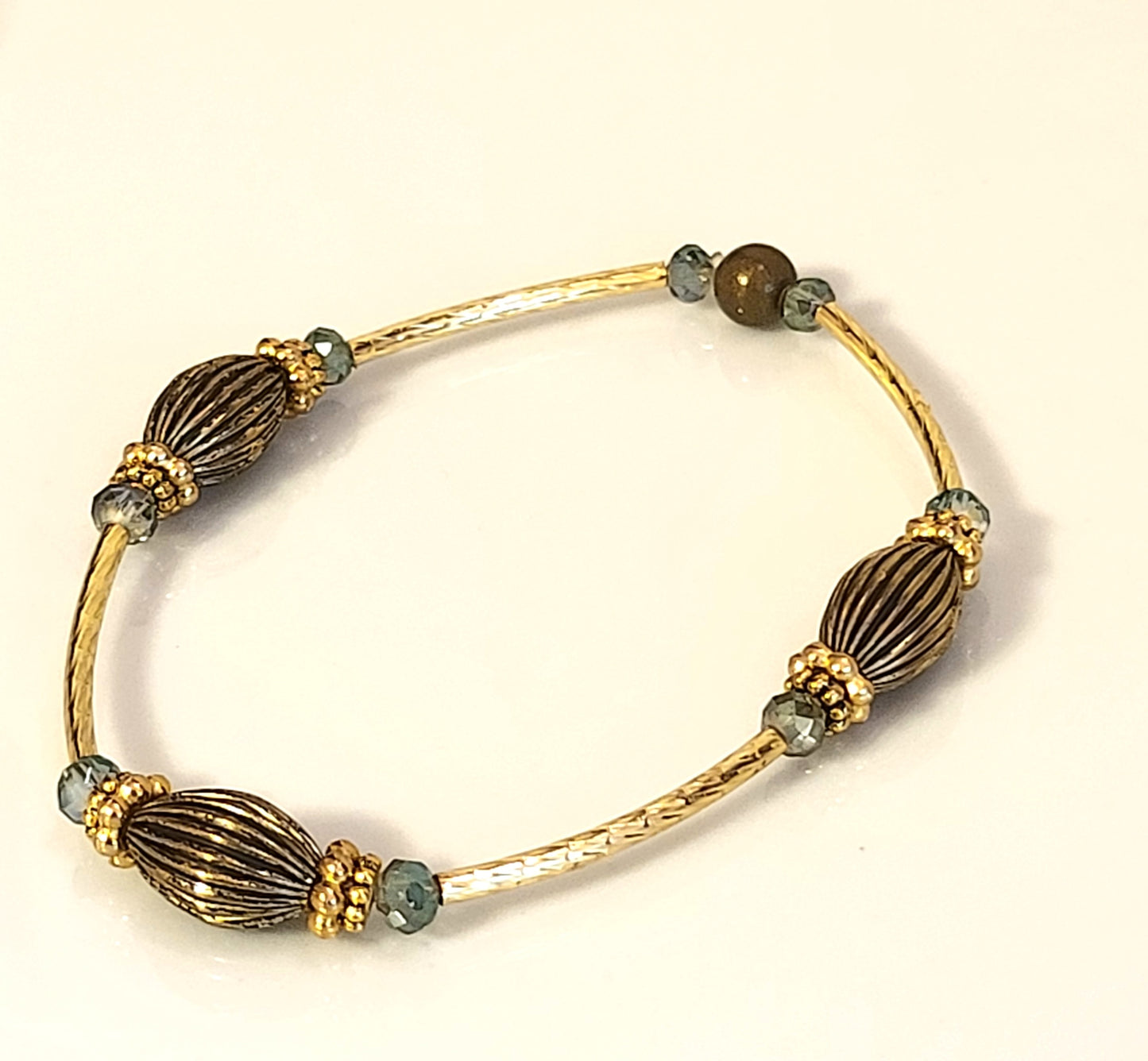 Gold Textured Tube and Antique Gold Stretchy Braclet