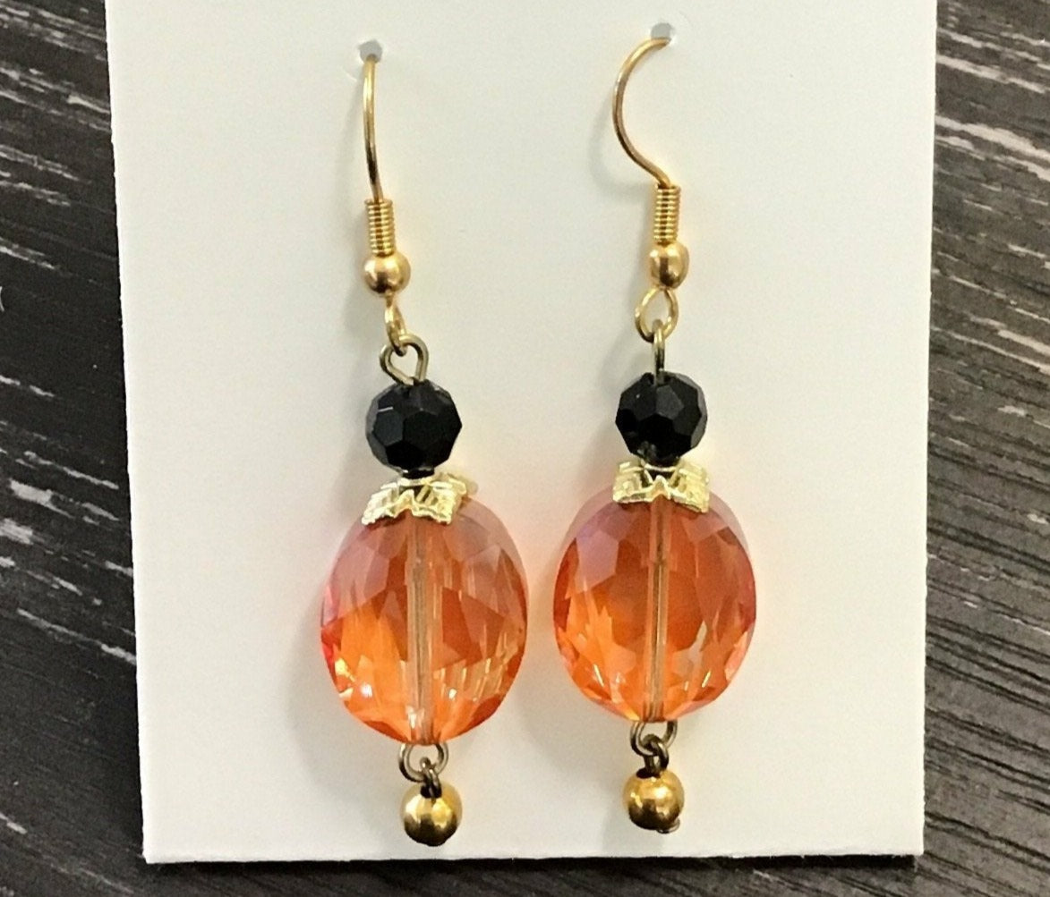 Orange crystal earrings with black
