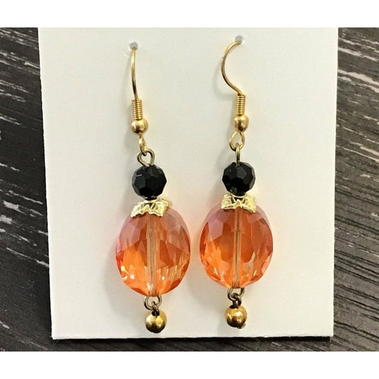 Orange crystal earrings with black