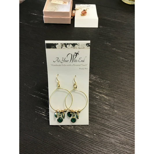 Gold hoops with round green dangles